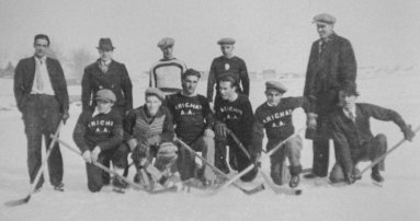 Arichat Athletic Assoc. Hockey Team: (L-R) Standing Carl Britt, Bob O'Leary, Jimmy MacDonald, Everett Burton, Marshall Bourinot, Kneeling, George Young, Jean Alfred (John) Goyetche, Wilbert Stone, Earl Bourinot, Joe Boudreau, Nelson Dobson (1937)